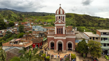 Camp, Antioquia. Colombia - June 23, 2024. Our Lady of the Rosary Parish located in the main park of the municipality.のeditorial素材