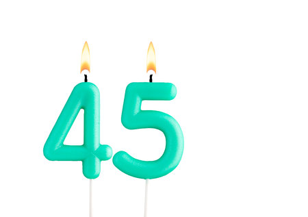 Green birthday candle on white background - Candle number 45の写真素材
