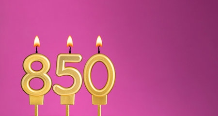 Birthday card with candle number 850 - purple backgroundの写真素材