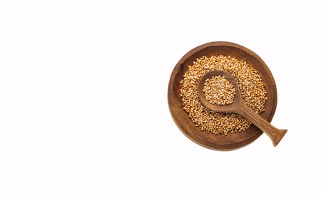 Organic amaranth seeds in the bowl and spoon - Amaranthus. white backgroundの写真素材