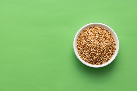 Amaranthus - Organic amaranth pops in the bowl. green backgroundの写真素材