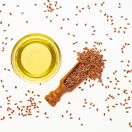 Healthy flaxseeds - Linum usitatissimum oil in glass bowl.の写真素材