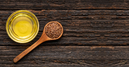 Linum usitatissimum - Organic flax seeds and oil in glass bowlの写真素材