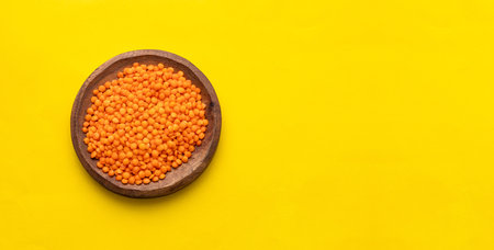 Lens culinaris - Bowl of raw red lentils.の写真素材