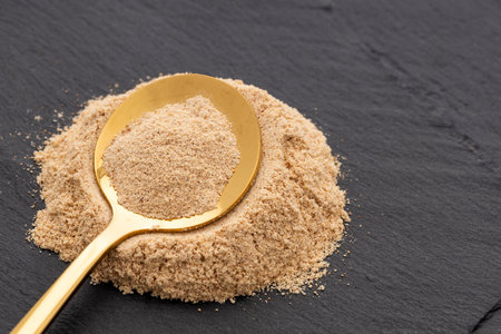 Lepidium meyenii - Ground organic maca in the spoon