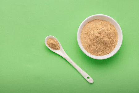 Lepidium meyenii - Organic Peruvian maca powder in spoon and bowl.の写真素材