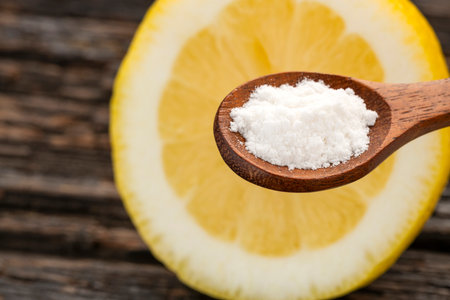 Baking soda on a spoon with lemon - Citrus Limonの写真素材