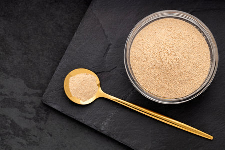 Peruvian maca or ginseng root in bowl and spoon  Lepidium meyenii.の写真素材