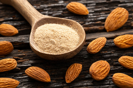 Raw organic almond flour in a spoon - Prunus dulcisの写真素材