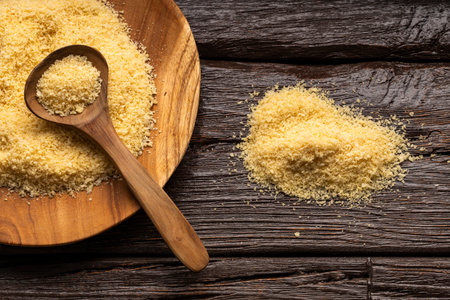 Yellow japanese panko crumbs in the spoon and bowl