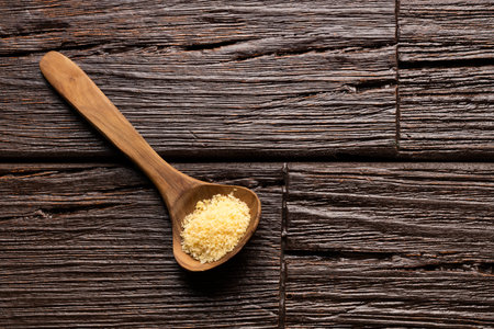 Japanese yellow panko crumbs a wooden spoonの写真素材
