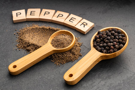 Aromatic black pepper in a spoon - Piper nigrum