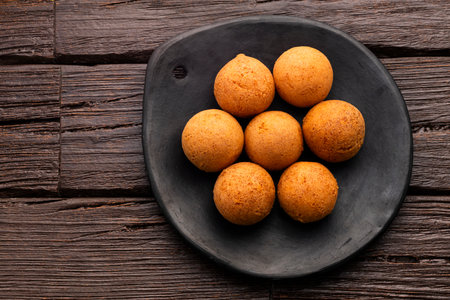 Delicious typical Colombian buÃ±uelos - round, fried with cheese