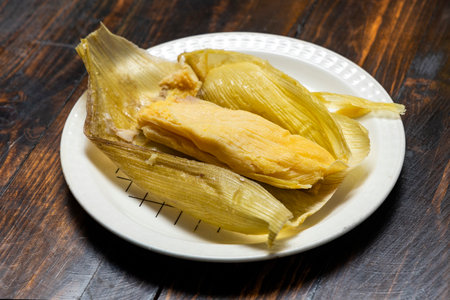 Traditional boyacense food - Wrapped in corn husksの写真素材