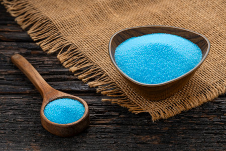 Fine blue crystal salt in a spoon and bowl - Persian blueの写真素材
