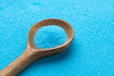Fine blue salt crystals in a spoon - Potassium fluorideの写真素材