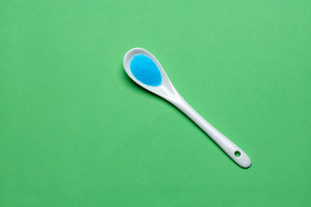 Blue sea salt in a spoonの写真素材