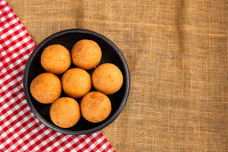 Crispy Colombian buÃ±uelos on a plate - Traditional food