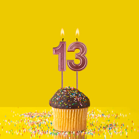Number 13 candle - Birthday candle with chocolate cupcakeの写真素材