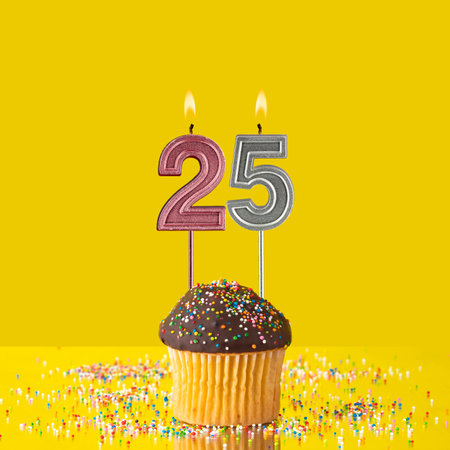 Number 25 candle - Birthday candle with chocolate cupcakeの写真素材