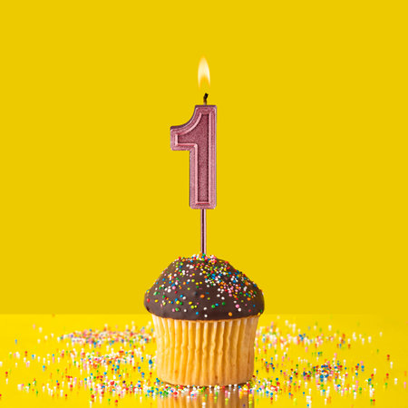 Number 1 candle - Birthday candle with chocolate cupcakeの写真素材