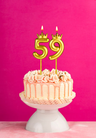Number 59 birthday candle - Pink celebration cake with drip icing