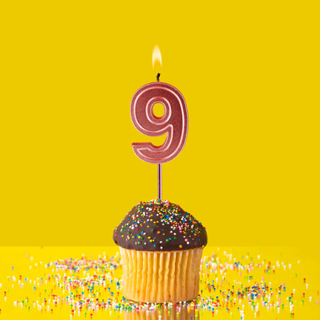 Number 9 candle - Birthday candle with chocolate cupcakeの写真素材