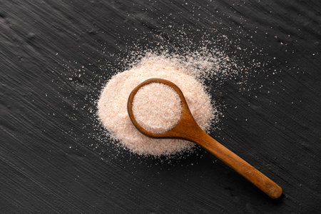 Pink Himalayan salt in spoon - Fine crystals sprinkled.の写真素材
