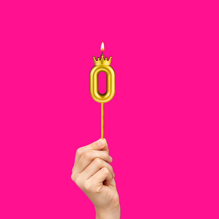 Hands holding number-shaped candles - Birthday number 0の写真素材