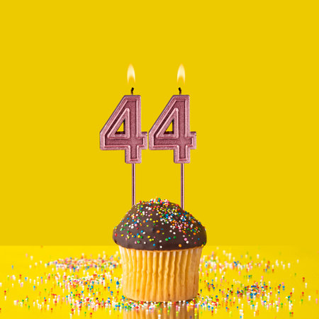 Birthday on a yellow background - Number 44 candle