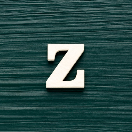 Capital letter Z, White letter on a rustic dark green backgroundの写真素材