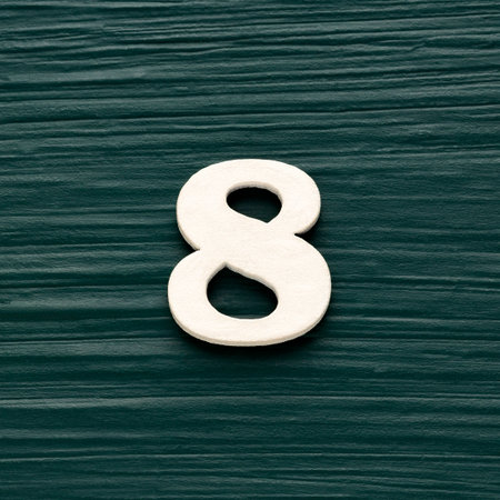 Number eight - White wooden number on a rustic dark green background