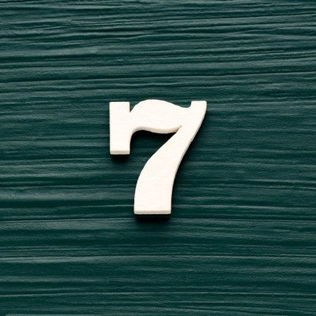 Number 7 white piece on a rustic dark green background
