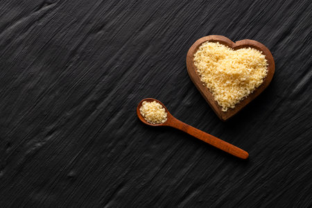 Fresh crispy panko crumbs in a wooden spoonの写真素材