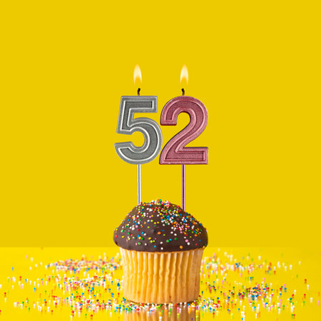 Birthday on a yellow background - Number 52 candle