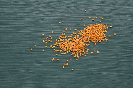 Pile of natural organic fenugreek seeds - Trigonella foenum - graecum
