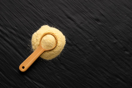Durum wheat ground in a spoon - Wheat semolina. Triticum vulgare