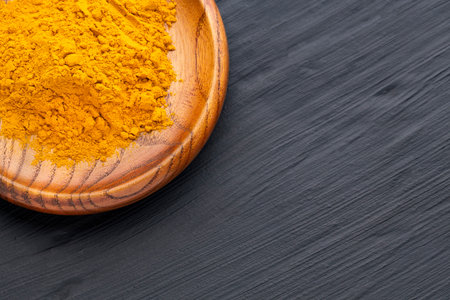 Curcuma longa - Dried organic turmeric in a bowlの写真素材