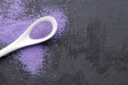 Blueberry flavored sugar on a spoon - Cocktail rim decorationの写真素材