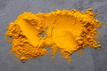 Finely dried turmeric powder scattered - Curcuma longa