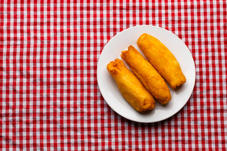 Cheese filled carimaÃ±ola - Typical Colombian street food