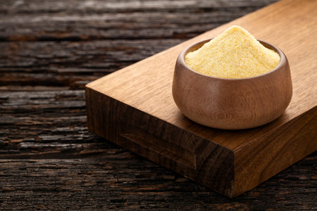 Wheat semolina in a wooden bowl - Triticumの写真素材
