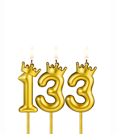 Golden number 133 birthday candle on white backgroundの写真素材