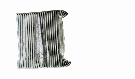 A used car air conditioning filter that is dirty and needs to be replaced