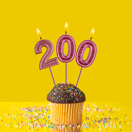 Candles forming the number 200 - Yellow background.の写真素材