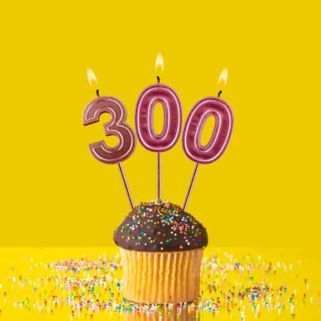 Candles forming the number 300 - Yellow background.の写真素材