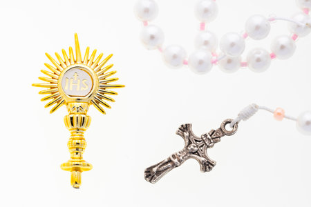 Golden brooch, Golden religious symbol with IHS monogram and Catholic rosary
