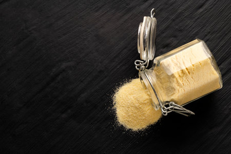 Triticum - Coarse wheat semolina flour in a glass jarの写真素材