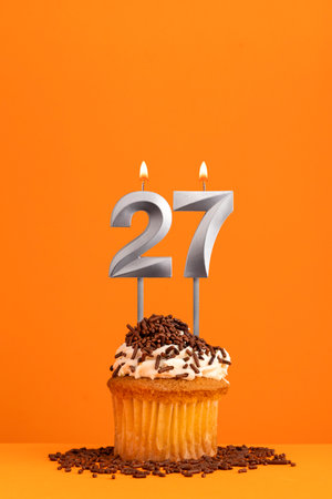 Birthday candle number 27 - cupcakeの写真素材