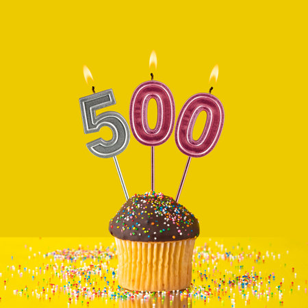 Candles forming the number 500 - Yellow background.